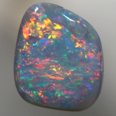 SOLID SEMI BLACK OPAL Sparkling red and orange over green blue